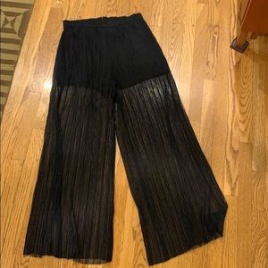 Wide leg sheer pants with attached shorts.